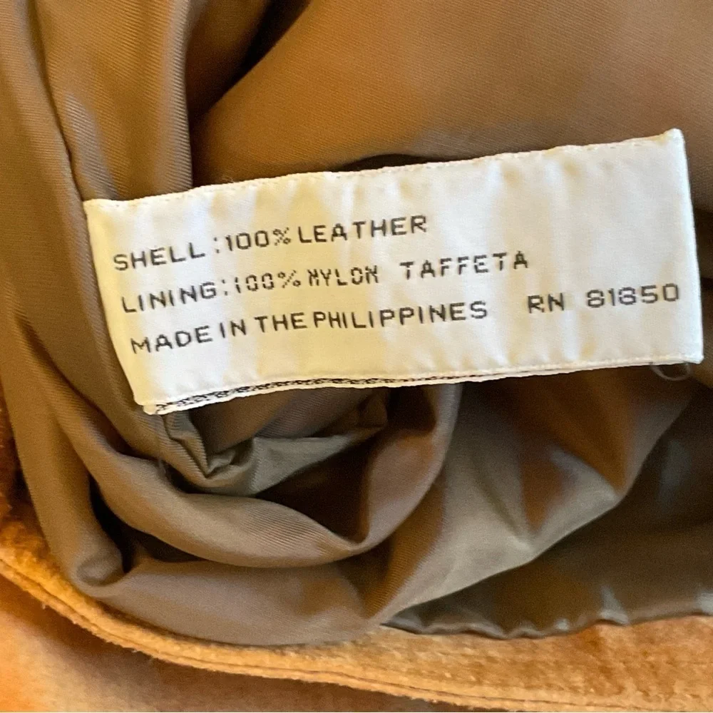 True vintage suede—real leather with clean tailoring an earlier designer era.